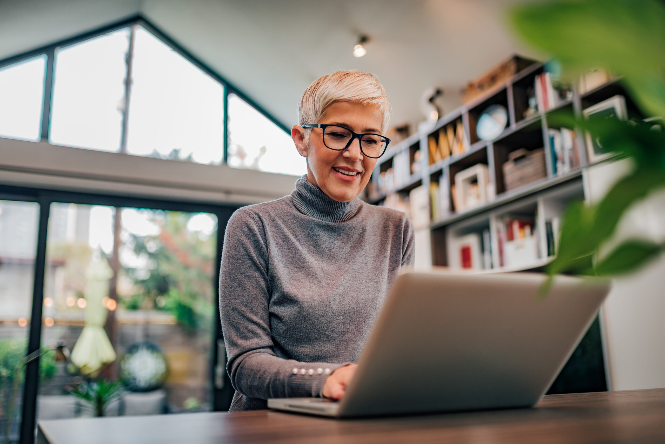 Woman smiling at laptop